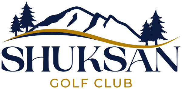 Logo for Shuksan Golf Club featuring navy blue pine trees and mountains above the club name, with a gold curved line and “Golf Club” written in gold below “SHUKSAN.”.